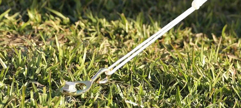 Heavy Duty Lag Bolts Kit With HexHook Pro Anchoring Plate 12 Pack installed in grass for GroundGrabba Pro stakes