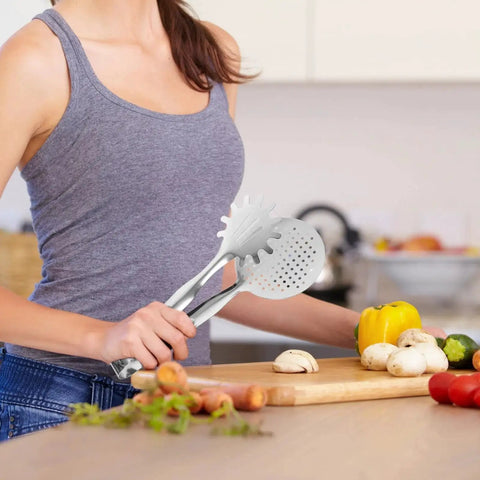 Woman using Stainless Steel Oil Filter Food Clip And Frying Tongs For Steak Draining Deep Fry Strainer And Grilling Tool in kitchen