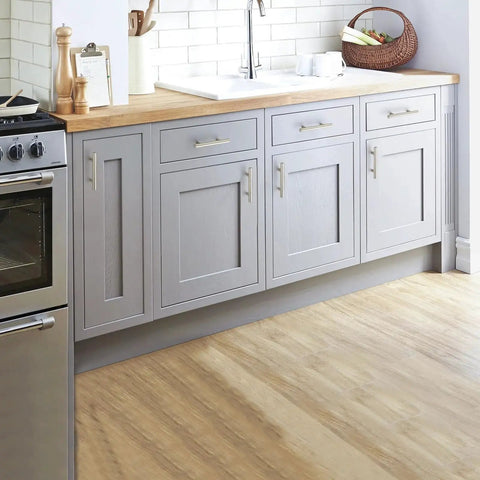 Modern kitchen with 30 Pack 5 Inch Cabinet Pulls With 3 Inch Hole Centers Zinc Alloy Handles In Brushed Nickel Finish For Kitchen Cabinets Cupboards And Wardrobes, 1/2 Inch Diameter And 1-1/4 Inch Projection installed on gray cabinets.