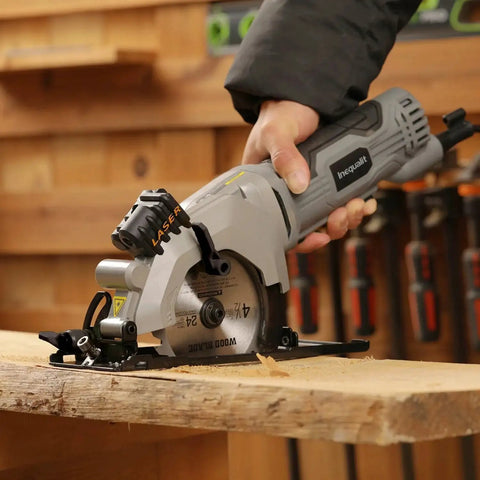 Person using Powerful Corded Four Amp Circular Saw With Laser Guide And Bevel Cuts, 3500 RPM, Four And A Half Inch 24T TCT Blades on wood