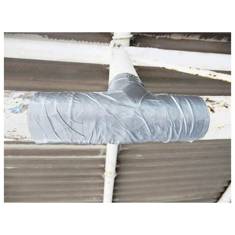 Silver duct tape 1.88 Inch By 60 Yard for quick repairs and sealing, wrapped around metal pipes as a temporary fix.