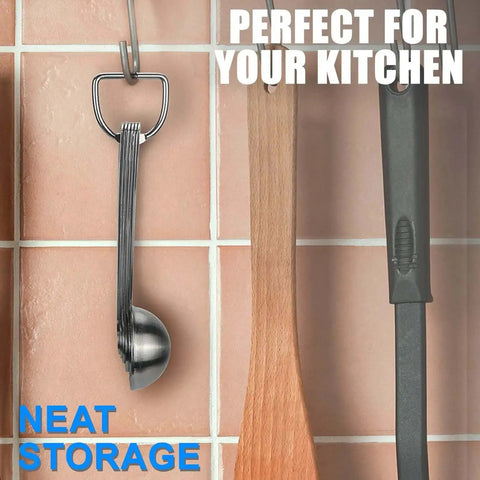 Hanging Must Have Sturdy Stainless Steel Measuring Spoons Set Of 6 With Metric And US Measurements against kitchen wall.