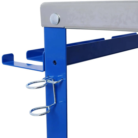 Close-up of blue 36x18 Inch Heavy Duty Welding Workbench On Wheels With 1200 Pound Load Capacity showing tool slots and tray.