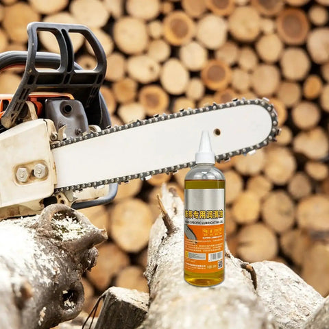 Friction-Reducing Chainsaw Lubricant With Deep Rust Protection and Anti-Wear Formula next to chainsaw on wooden logs