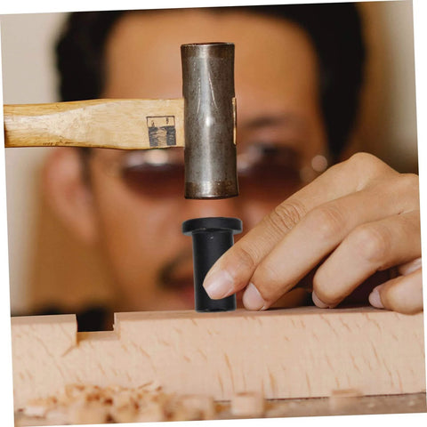 Person using hammer to install Adjustable Barn Door Hardware Kit with Track Spacers and Bolts on a wooden surface.
