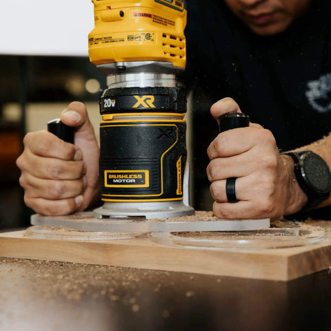 TrimFit Pro Dual Grip Router Base Plate for DeWalt DWP611 with dual handles in use on wood