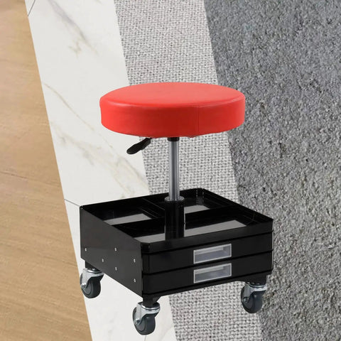 Red cushioned swivel stool with storage drawers and caster wheels on textured multi-surface background.