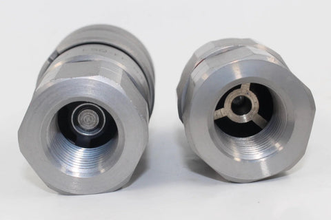 Pair of silver 1/2'' NPT flat-face hydraulic quick-connect couplings with hex bodies.