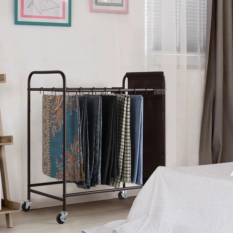 Four Wheel Pants Rack With 30 Hangers And Built In Oxford Bag For Small Items, shown in a bedroom with colorful towels hanging.