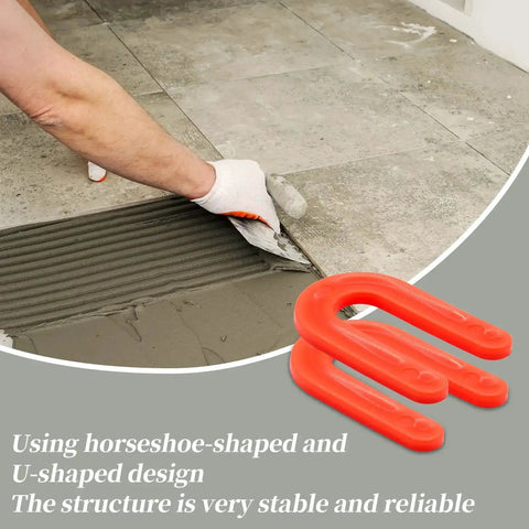Red 50 Pack U Shaped Tile Spacers One Eighth Inch For Leveling next to hand laying tile with mortar in DIY project