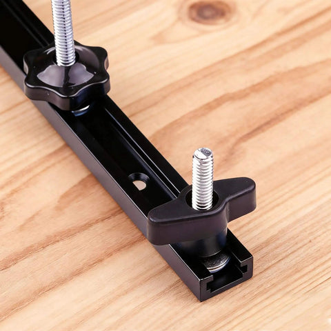 Close-up of 4 Piece 48 Inch Aluminum T Track Set for Woodworking Jigs and Fixtures with Screws, installed on workbench
