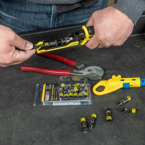 Fast Install F Connector For RG6 Coax With Universal Sleeve Compression Technology That Clips On Five Times Faster No Fuss in use with tools and packaging visible