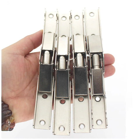 Set of four Sleek Invisible Concealed Hydraulic Buffer Cabinet Hinges for effortless quiet closing and space saving design in hand