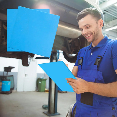 Gasket sheets, 6-piece blue set, 8x8 inch, high-temp non-asbestos material, held by a mechanic under a car.