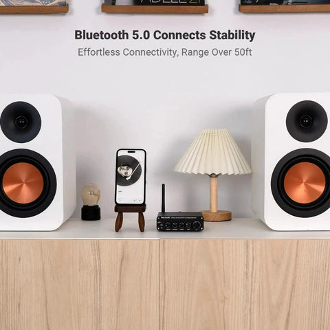 BT30D Bluetooth 5.0 2.1 Channel Stereo Receiver Amplifier setup with speakers on a cabinet