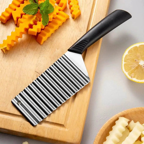 Wave Potato Cutter Crinkle Slicer For French Fries And Veggies Stainless Steel Kitchen Utensils on a wooden board.