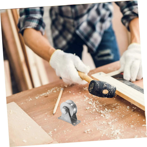 Carpenter working with a mallet on wood, showcasing a Stainless Steel Groove Wheel Pulley for Sliding Doors and Barn Doors in foreground.