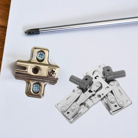 Soft Close Downward Cabinet Hinges With Damping For Concealed Doors, Easy No Fuss Install For Shoe Cabinets And Furniture, 2 Pack Tip Out Tray Compatible Hinges With Hidden Screws By DONFAMDS shown uninstalled on white surface with screwdriver