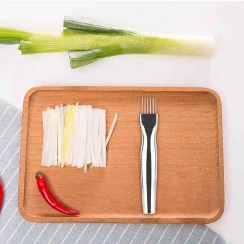 Scallion and chili with Game Changing Mandoline Slicer For The Kitchen Pro Grade Vegetable Cutter shown on a wooden tray.