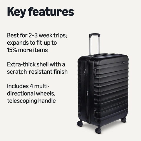 Big 30 Inch Hardside Checked Luggage With Four Spinner Wheels Scratch Resistant Shell Expandable Up To 15 Percent For Extra Packing Space Ideal For Two To Three Week Getaways Durable Black Suitcase side view with telescoping handle.