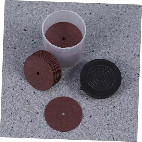 36 Piece Heavy Duty Cutting Discs And Grinding Wheels Set For Metal, Wood, And Ceramics with container on grey surface