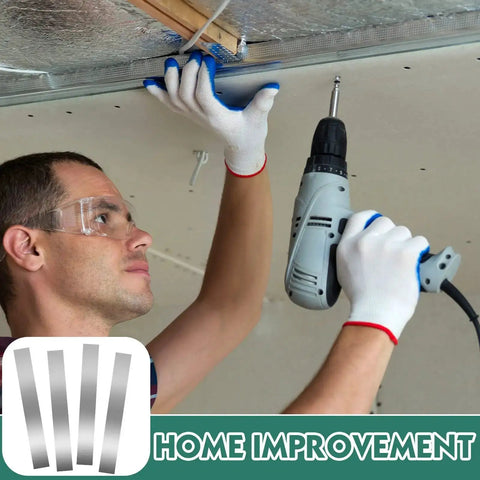Person installing ceiling drywall using electric drill, wearing gloves and safety glasses, concept of home improvement project.