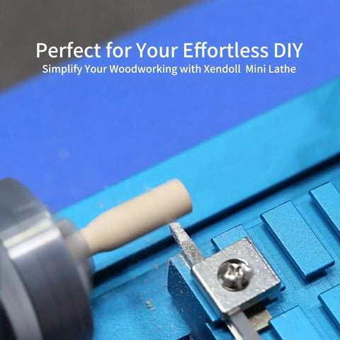 Mini Metal Lathe 36W Power Lathe For Hobbyists in use with blue frame, showing close-up of spindle turning wood piece
