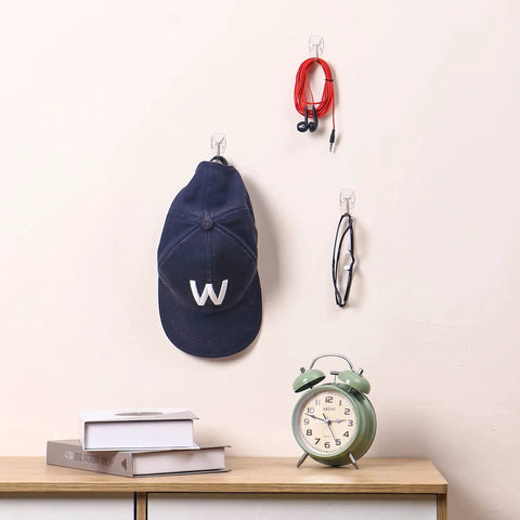 Clear Wall Hooks With Adhesive Strips 15 Hooks 30 Strips No Tools Damage Free displaying hat, cables, glasses hanging on hooks