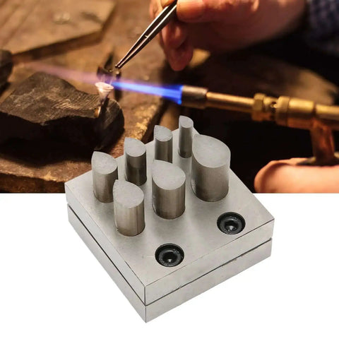 45 Steel Jewelry Punch Die Disc Cutter Set Drop Shaped 7 Piece Forming Tools in use with crafting flame