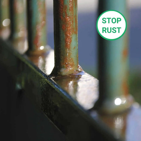 Close-up of rusted metal bars with a 'stop rust' symbol, illustrating use of All In One Heavy Duty Rust Inhibitor For Metal And Wood And Paint Conditioner 34 Oz Prevents Corrosion Improves Paint Flow And Adhesion Smooth Application Heat Resistant Protection For Metal Machinery And Industrial Equipment.