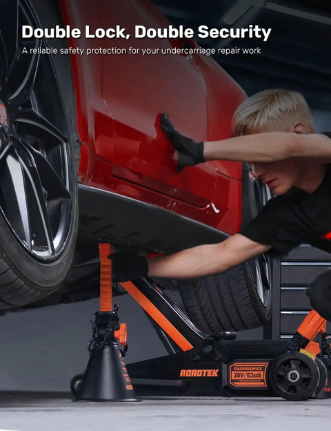 Technician using 3 Ton Jack Stands With Integrated Steel Base And Double Locking For SUV on red car in garage