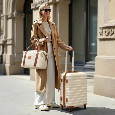 Woman with Lightweight Softside 3 Piece Luggage Set with 20 Inch Carry On Wheeled Luggage, duffel bag, and toiletry bag in urban setting