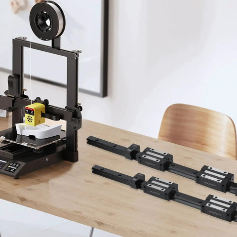 350mm HGR15 Linear Rail Kit With 4 HGH15CA Carriage Blocks And 4 HG15 End Stop Blocks for precision CNC motion on a table.