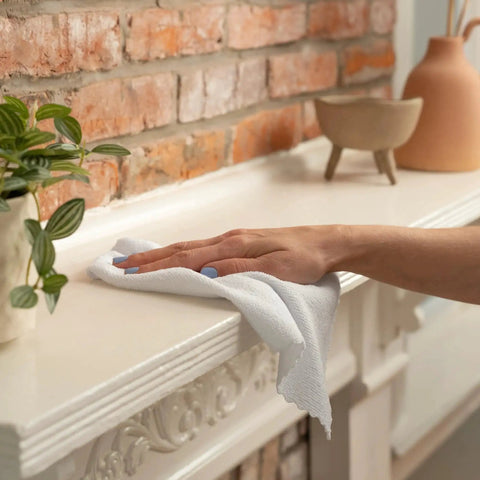 Cleaning a mantel with Two 50-Pack Microfiber Cleaning Cloths in Boxes 11.8x11.8 White 190gsm.