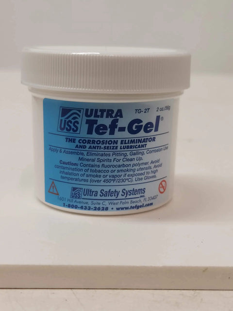 Front view of Tef-Gel 2 Oz Anti-Seize Lubricant With PTFE For Marine Hardware And Rigging, white container with blue label.