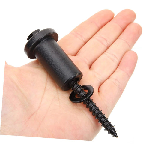 Close-up of a hand holding a 4 Pack Adjustable Barn Door Track Spacer and Wall Connector, heavy-duty black steel, wear resistant.