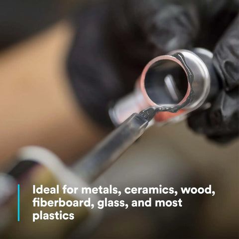 Applying DP190 Gray Epoxy Adhesive Duo-Pak 48.5 mL on metal for high shear and peel strength bonding.