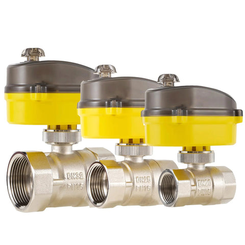 Three electric ball valves with yellow actuators on brass bodies with threaded ends