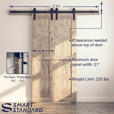 7 Foot Double Barn Door Hardware Kit With Smooth Quiet Sliding Track Easy Install For 21 Inch Wide Door Panel J Shape Hanger Black Includes Detailed Instructions And All Mounting Hardware For Quick No Sweat Level Quiet Operation In Any Interior, front view installed on wooden door.