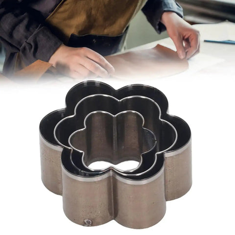 Close-up of 3-piece alloy steel flower-shaped leather hole punch die set for leatherwork, fabric crafts, and DIY projects.