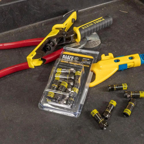Fast Install F Connector For RG6 Coax With Universal Sleeve Compression Technology That Clips On Five Times Faster No Fuss, Klein Tools VDV812606 compatible pack on workbench with tools.