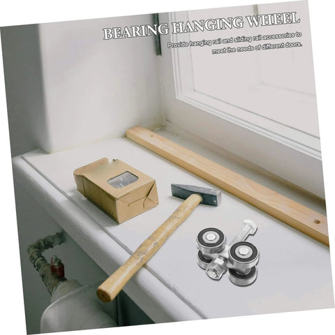 Stainless Steel Double Bearing Caster Wheel For Sliding Gates And Barn Doors Heavy Duty Track Roller on a windowsill with tools
