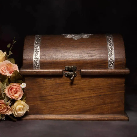 Wooden jewelry box with Vintage Style Mini Swing Arm Clasp Latch Set and antique bronze hinges, surrounded by flowers.