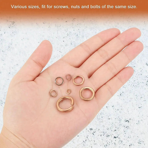 Hand holding various sizes of 20 Pack Copper Spring Lock Washers M8 Split Lock Washers For Screws Bolts Nuts Inner 8.1 To 8.7 Mm Outer 12.1 To 13.1 Mm Thick 2 To 2.2 Mm With Pickling Finish No Slip Built Tough For Auto DIY Projects.