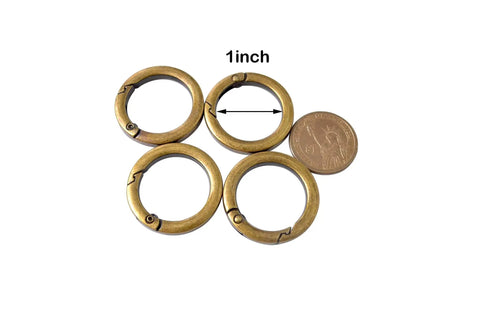 4 Pack Round Carabiner Key Rings With Spring Snap Clips And Flat O Rings In Brushed Brass Finish, shown with coin for scale