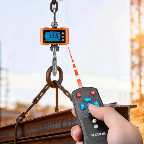 Beast Of A Digital Crane Scale With 4400 Lbs Capacity in use, showing LCD display and remote control in industrial setting.