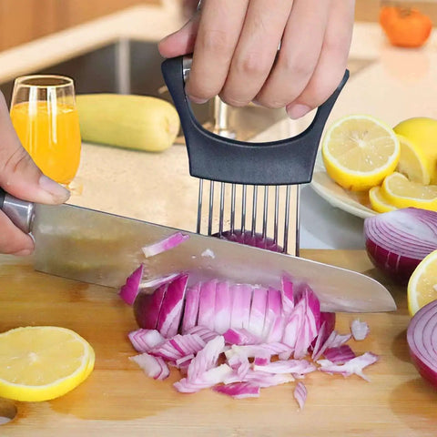 Versatile Onion Slicer With Ten Stainless Forks For No Slip Grip used to slice a red onion on a wooden cutting board