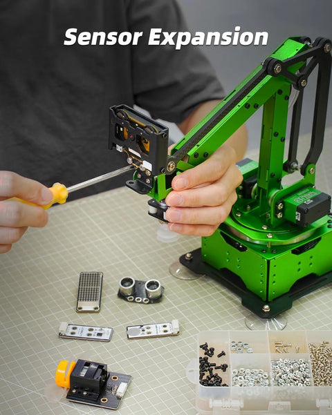 LewanSoul robotic arm kit with a green metal arm, bus servo, and suction nozzle on a work surface.