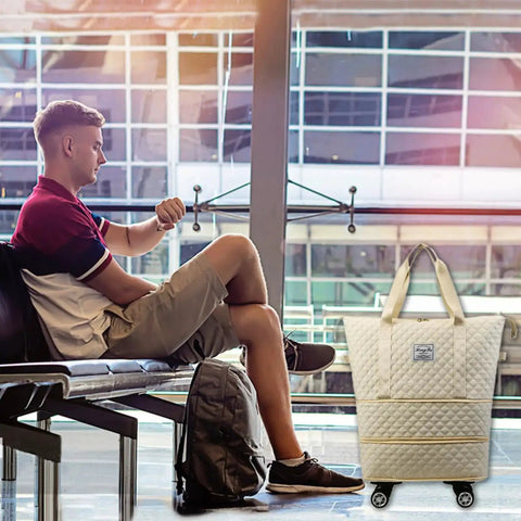 Man waiting with Rolling Duffle Bag With Wheels Expandable And Foldable Travel Luggage Carry On Bag at airport terminal