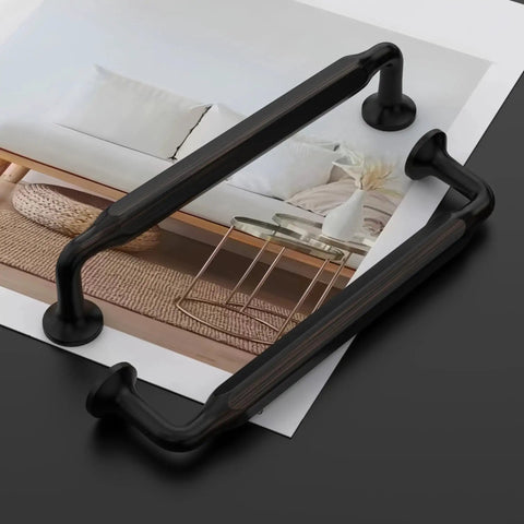 Oil Rubbed Bronze Cabinet Pulls 5 Inch 10 Pack Kitchen Cabinet Hardware, showing two pulls on a black surface with decor background.